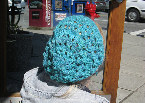 Slouchy handknit hat made with handspun, hand-dyed yarn. Lotsa hands!