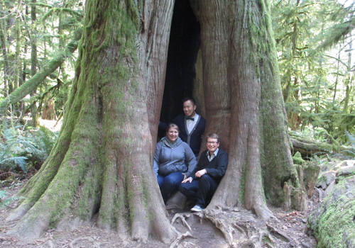 Three of Us inside a tree, Cathedral Grove, Vancouver Island